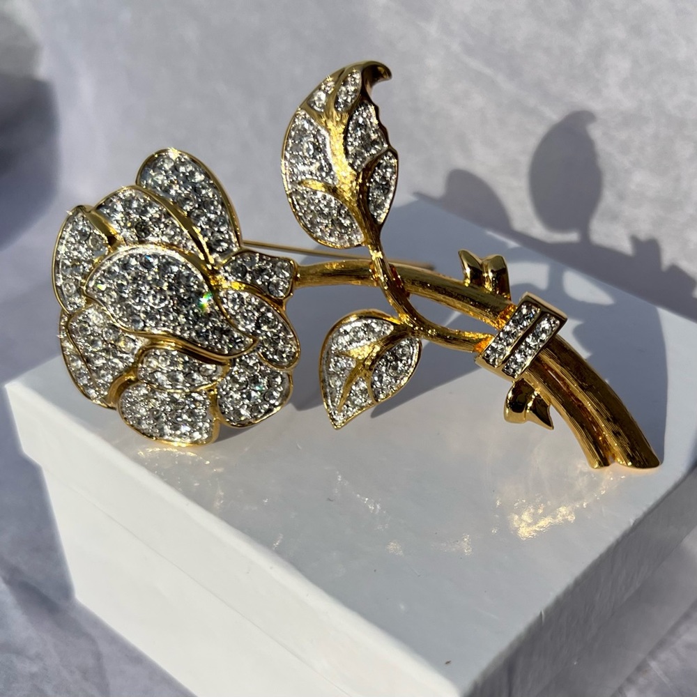 & Nolan Miller Vintage rhinestone encrusted flower brooch.